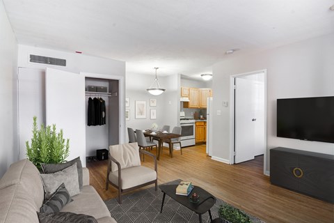 a living room with a couch and a table and a tv